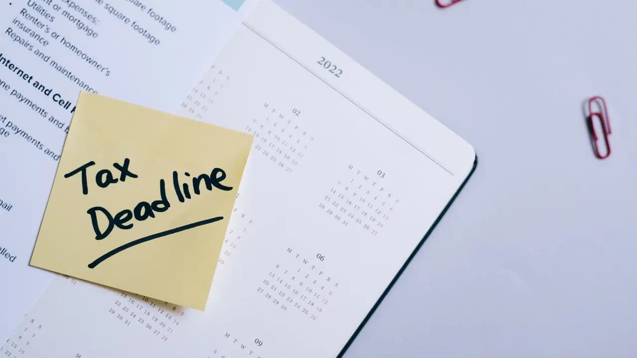 A tax deadline marked on a desk calendar next to documents