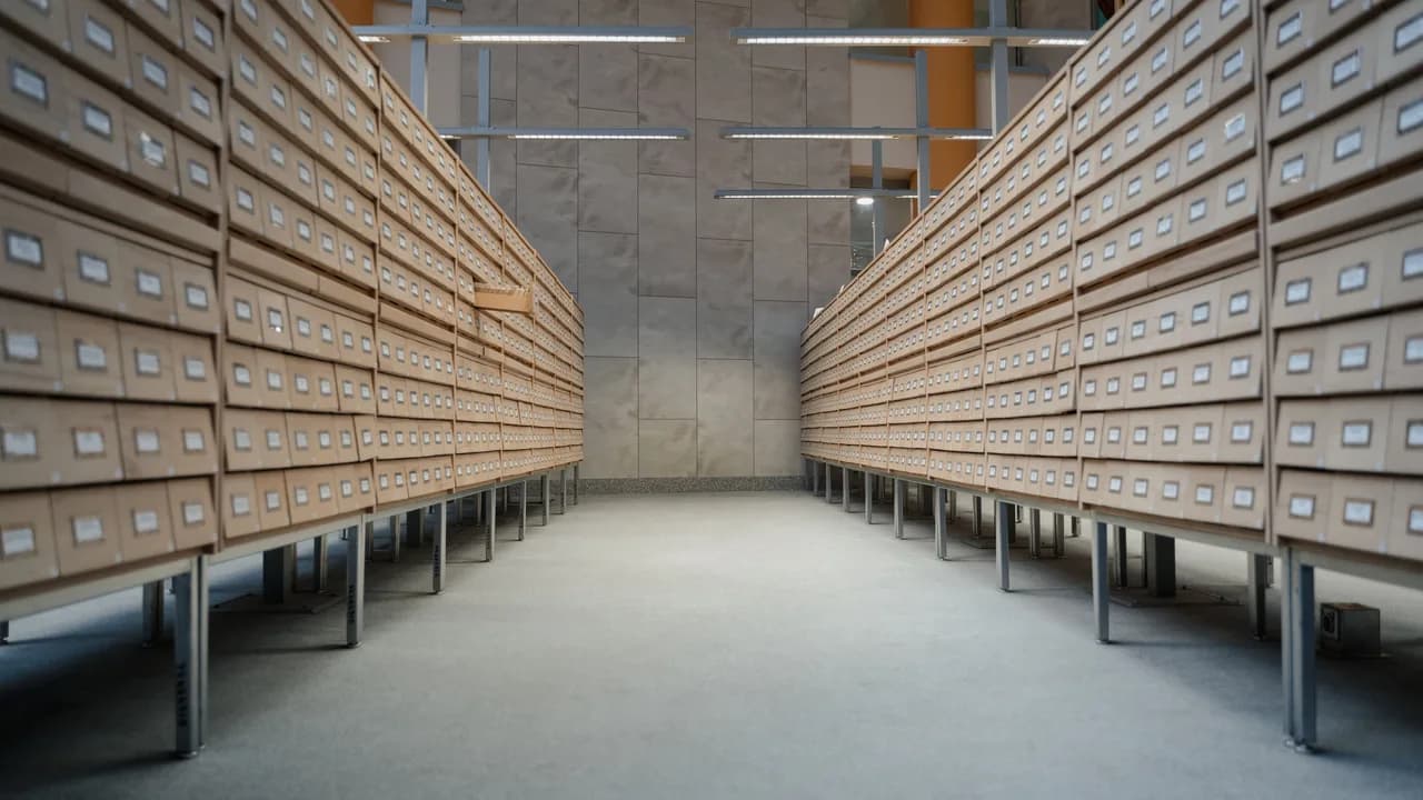 Rows of wooden drawers along a wall